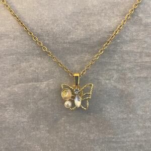 Butterfly pendant necklace with faux pearl and rhinestone details